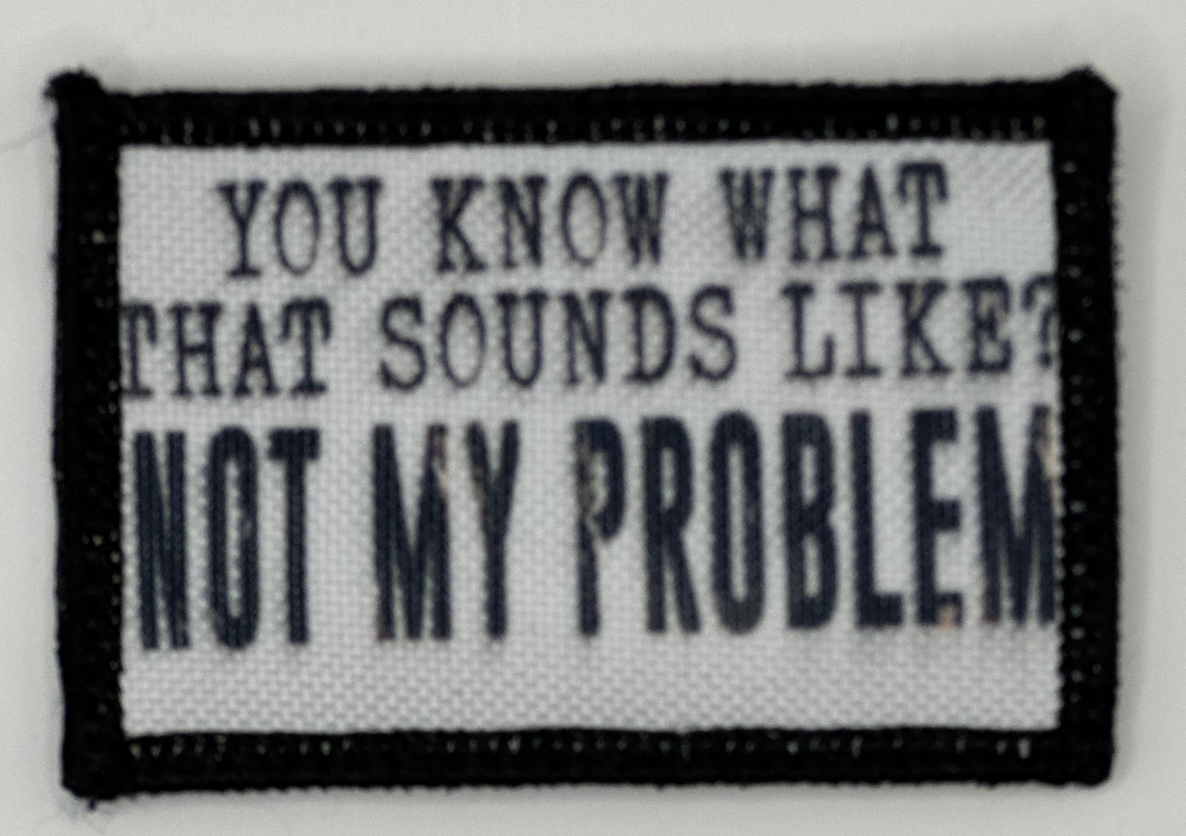 a black and white patch with words on it