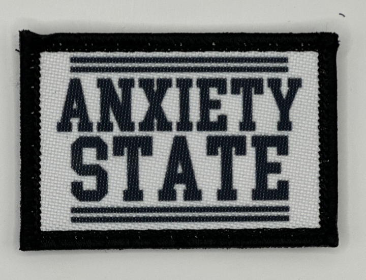 a black and white patch that says,'anxiety state '