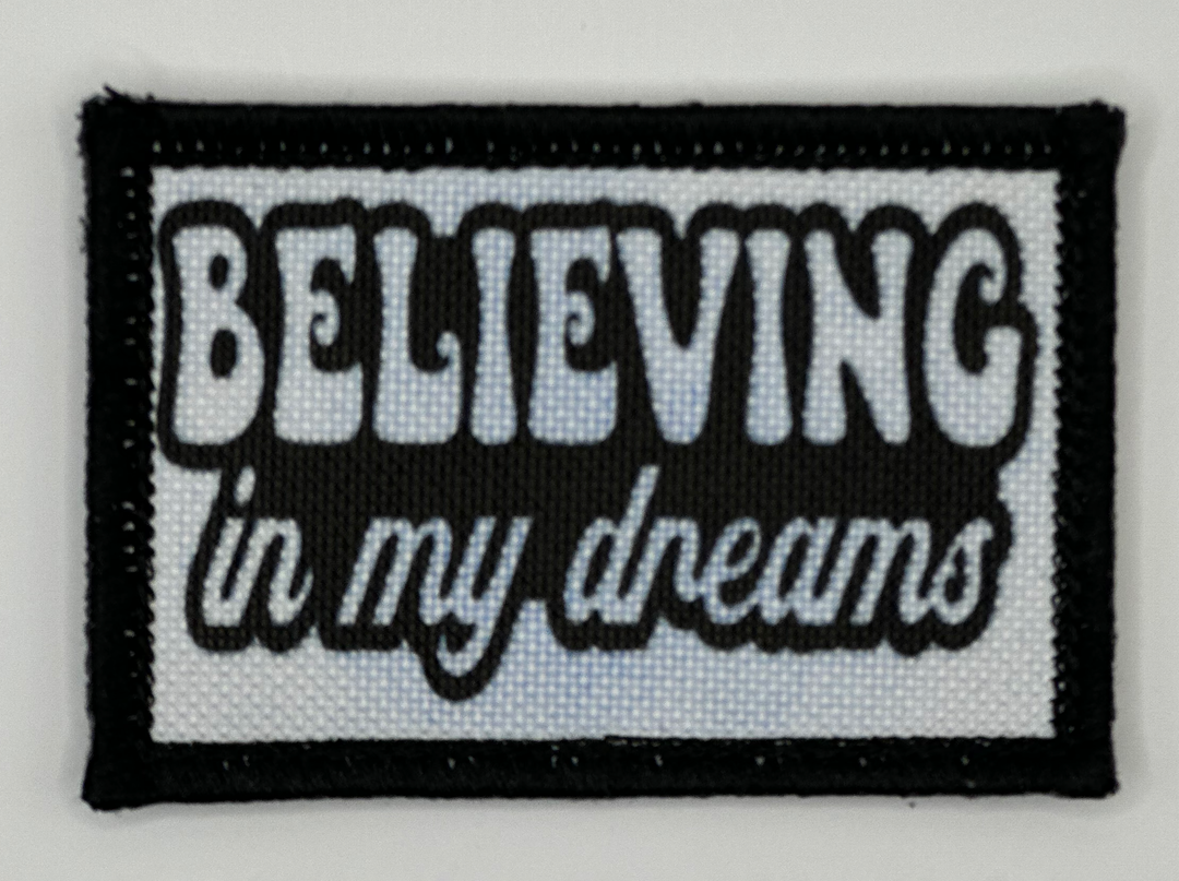 a black and white patch with the words believing in my dreams