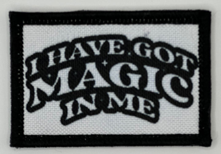 a black and white patch with the words have got magic in me