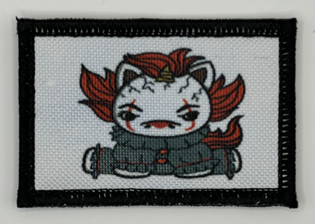 a cross stitch picture of a cat with red hair