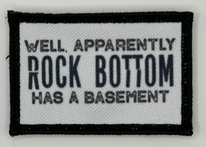 a patch that says well, apparently rock bottom has basement
