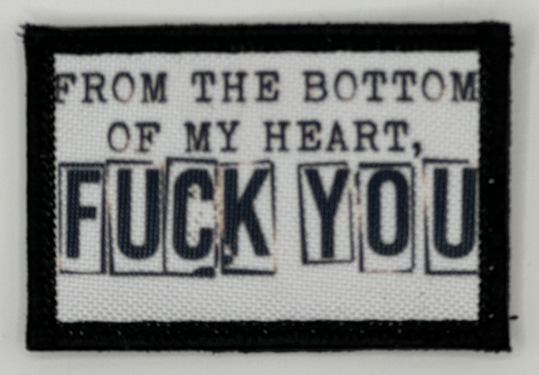 a black and white patch with words on it
