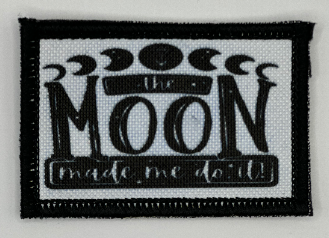a black and white patch with a picture of the moon