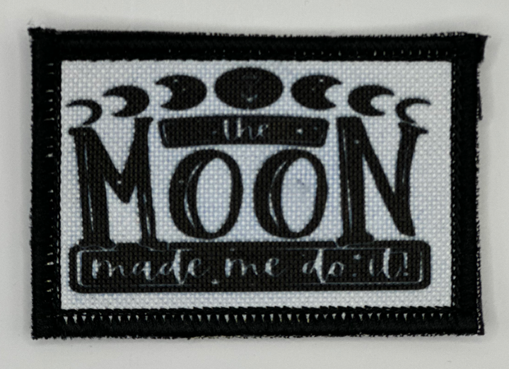 a black and white patch with a picture of the moon