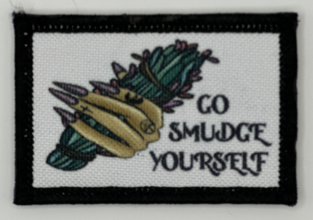 a picture of a badge that says go smudge yourself