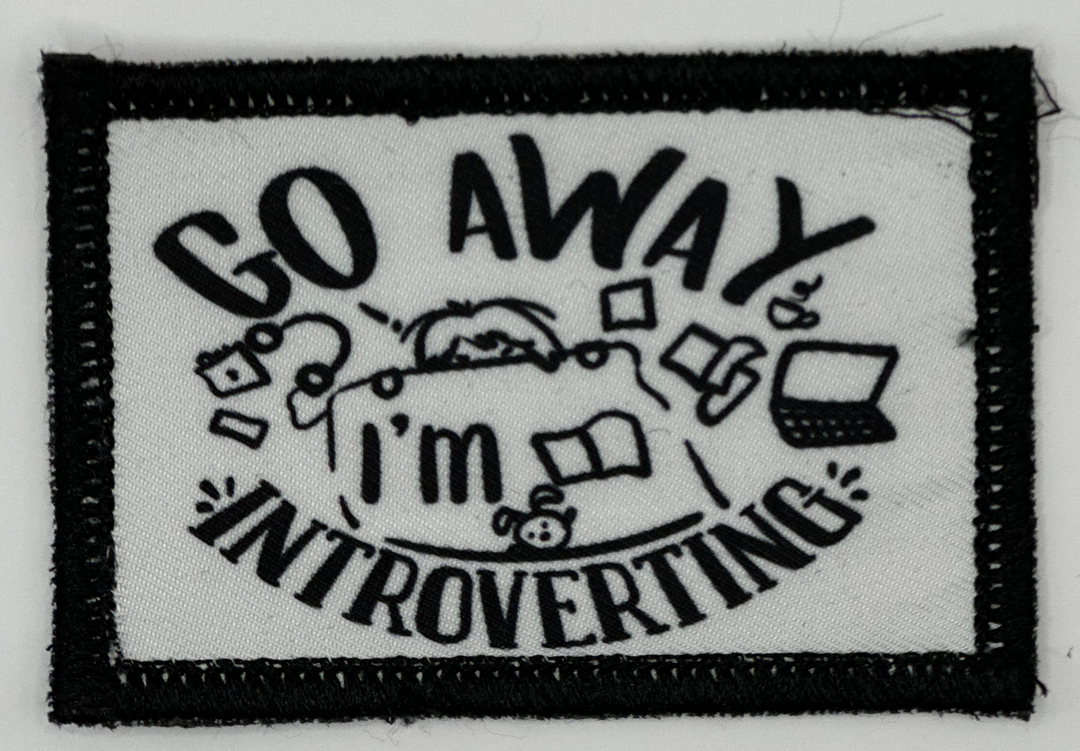 a black and white patch with the words go away