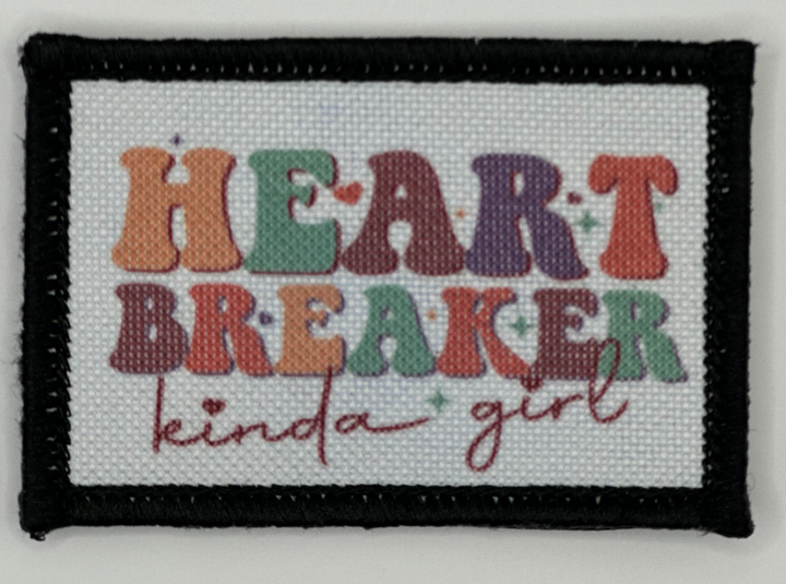 a cross stitch picture with the words heart breaker kind of girl