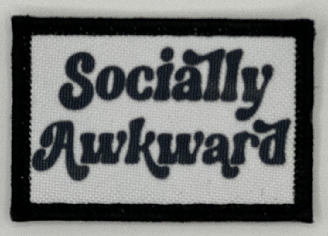 a black and white patch that says socially awkward