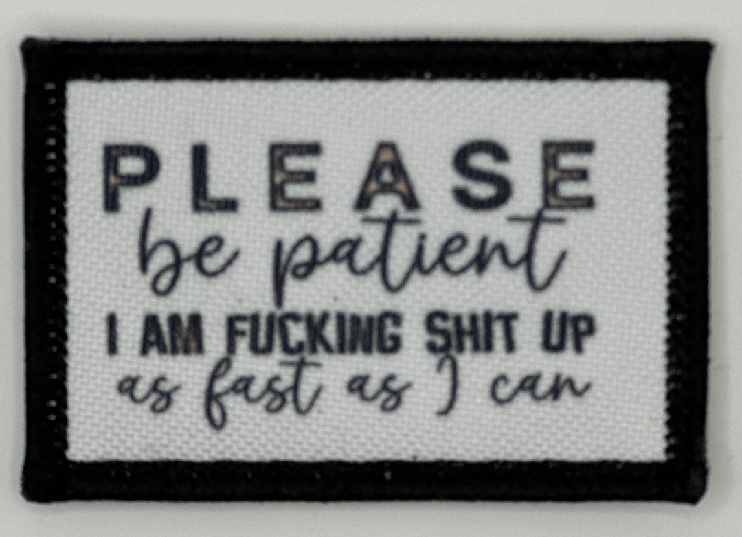 a white and black patch with words on it