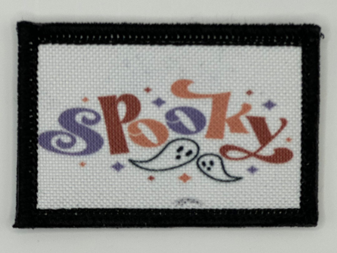 a cross stitch picture with the word spooky on it