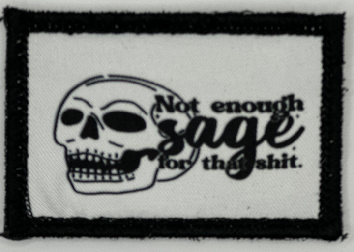 a black and white patch with a skull on it