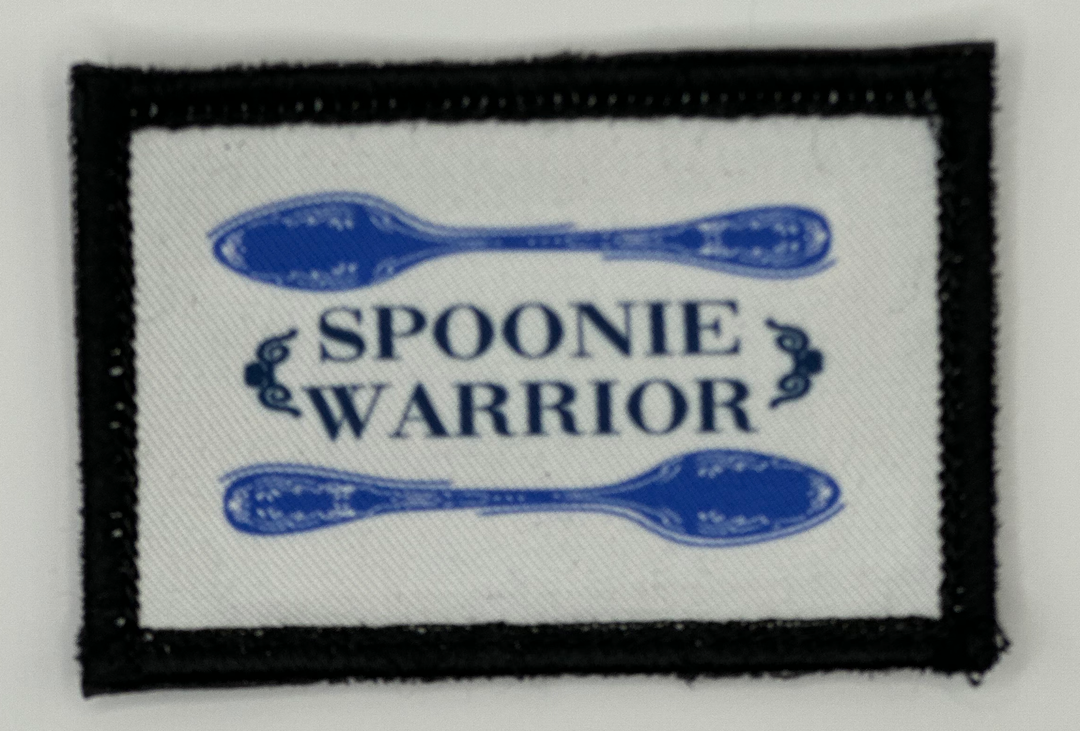 a patch with spoons on it that says spoonie and warrior
